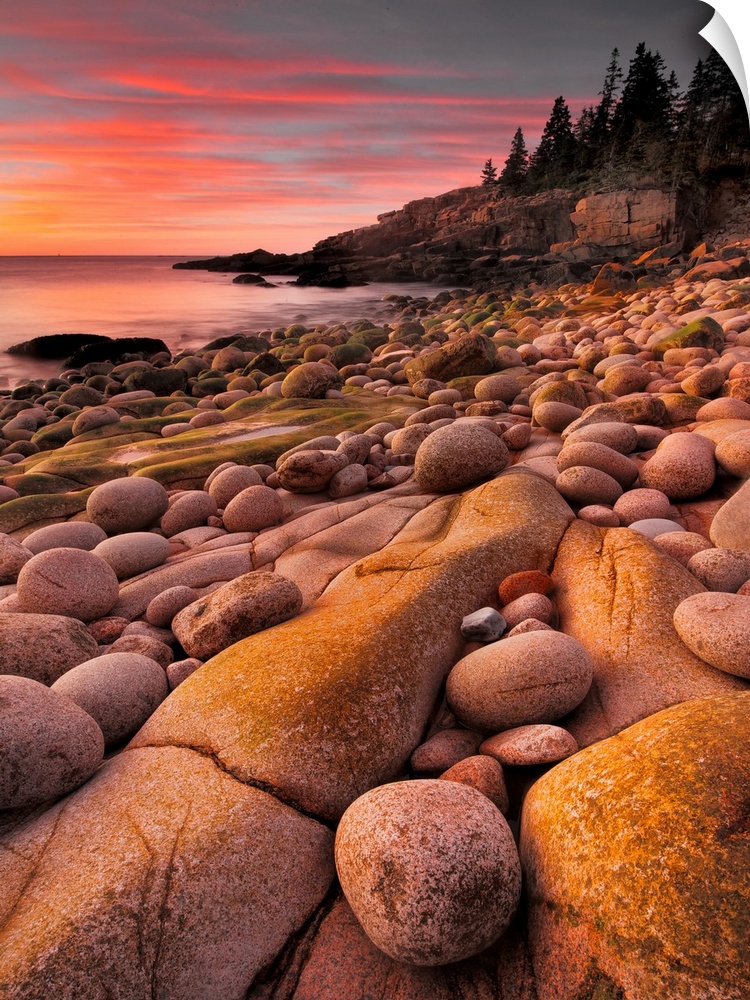 Smooth round stones covering the beach in Acadia National Park, Maine, in the morning.