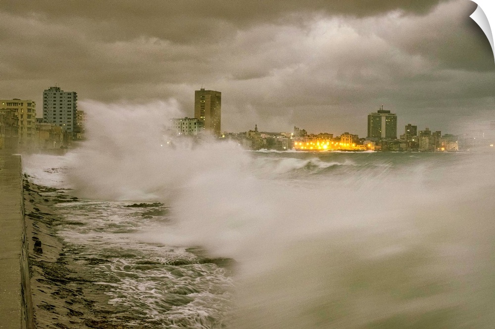 Stormy seas off the coast of Cuba, with lights from Havana in the distance.