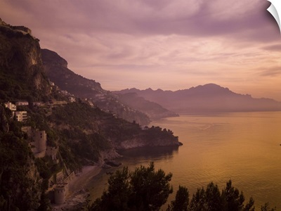 A beautiful sunset turns this view of the Amalfi Coast purple and orange