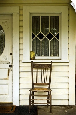 A chair on a porch