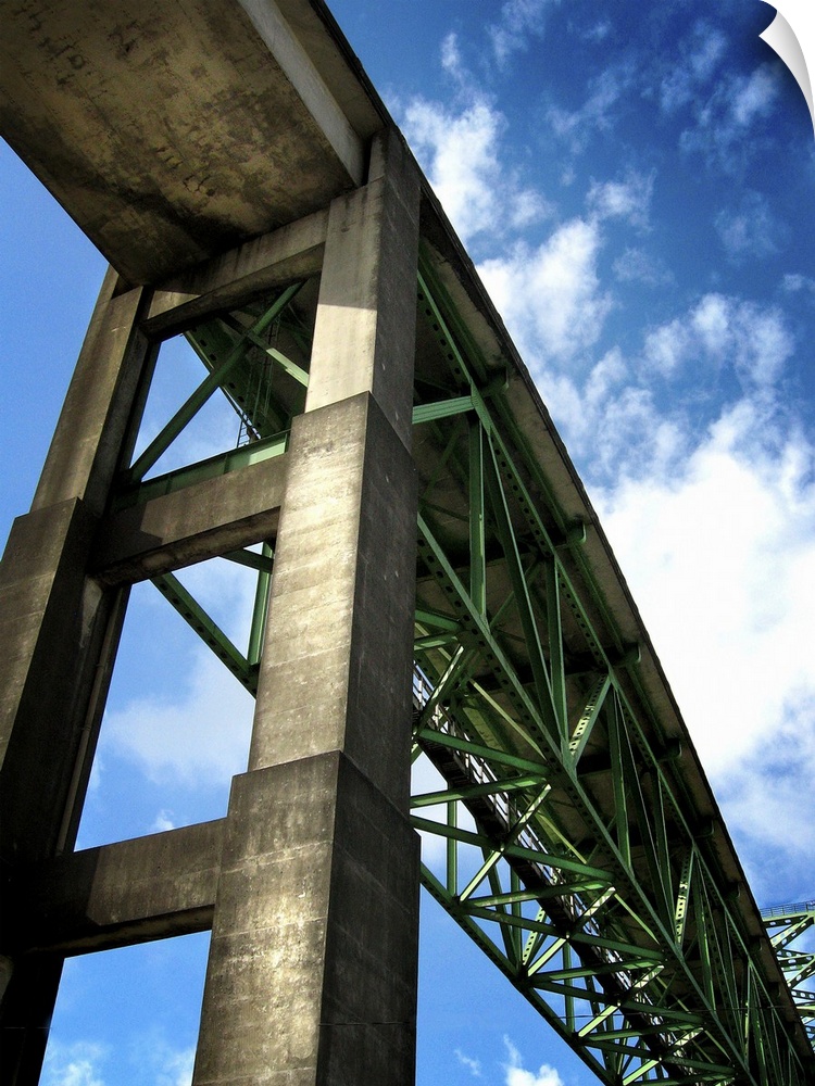 A high rail bridge against a blue sky