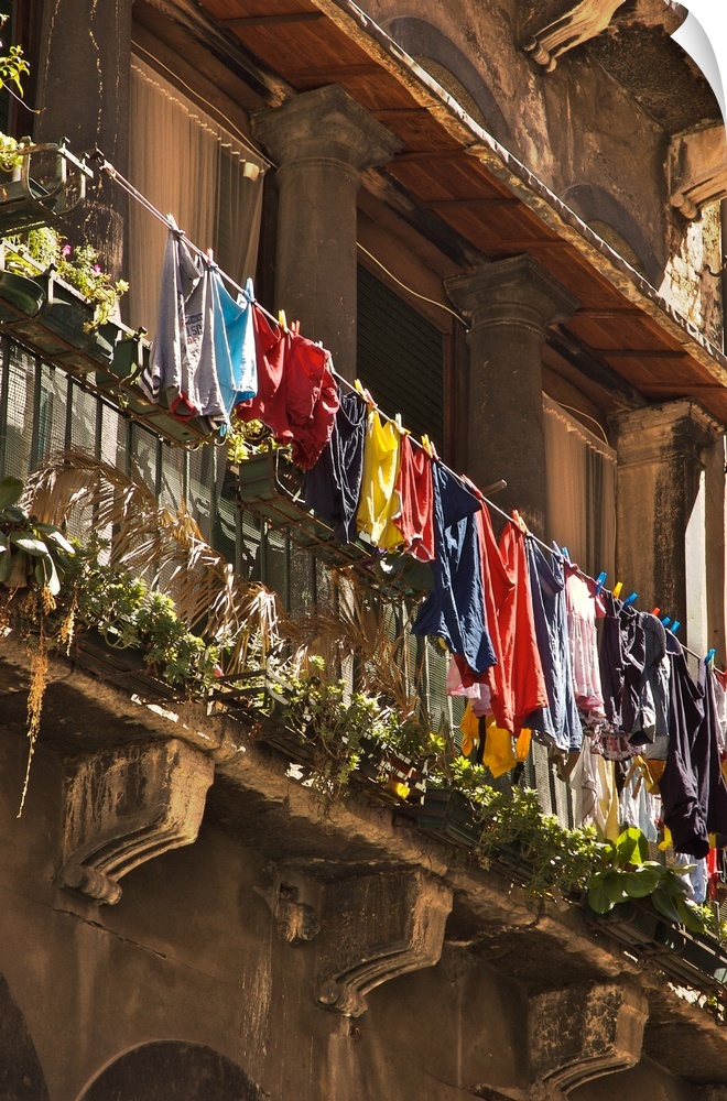 Italian building with balcony and hanging washing in Venice