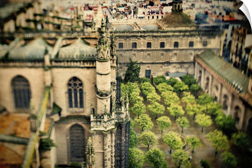View of the Cathedral and Orange Tree Yard from the top of the Giralda tower, Seville, Spain. Tilted lens used for a shall...