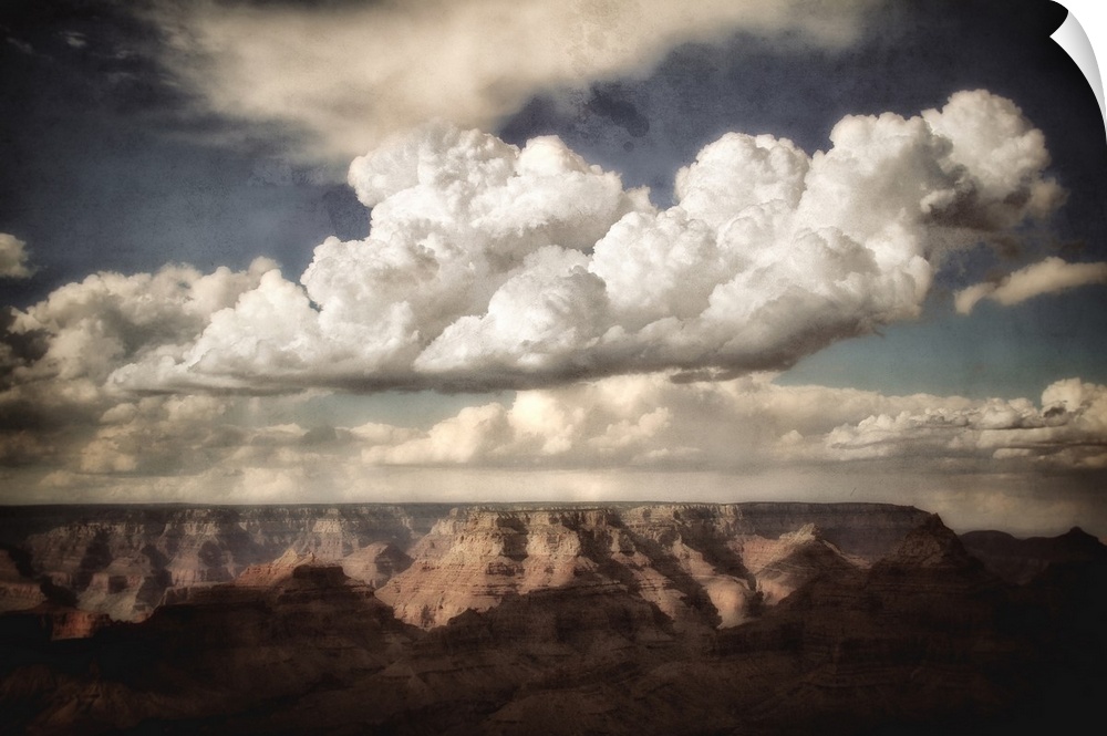 Huge canyon in the background looking across the Grand Canyon in USA with clouds in a blue summer sky with texture layer