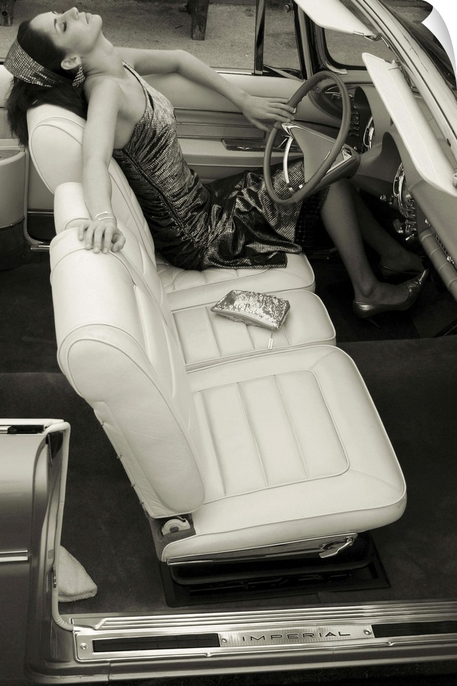 A young model sitting in the driving seat