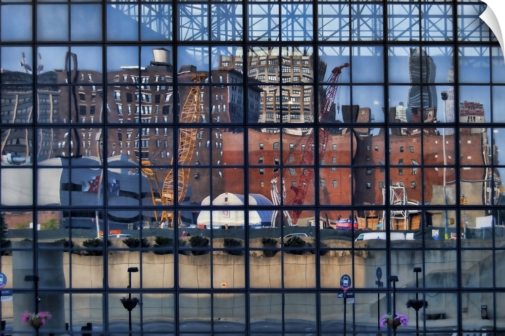 Reflection of a construction site and other buildings in the windows of the Jacob K. Javits Center, Manhattan, New York City.