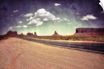 Large monolithic rocks in the background looking through Monument Valley V