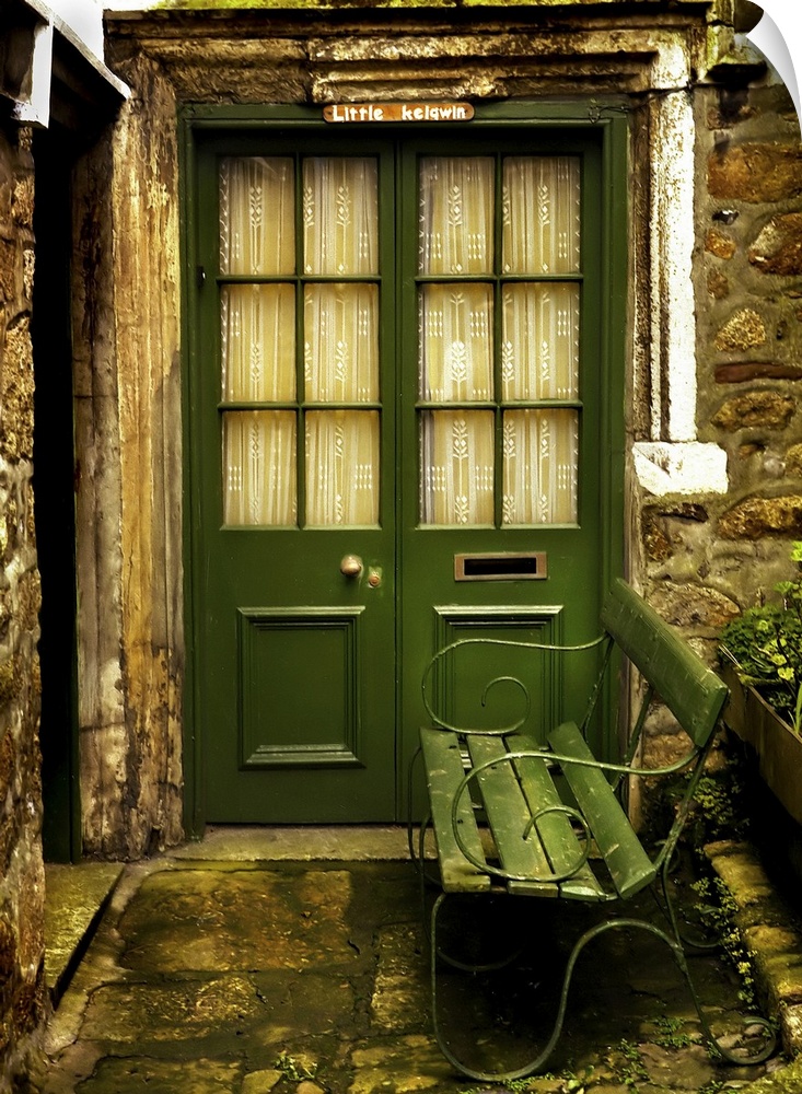 A doorway and a bench at a cottage