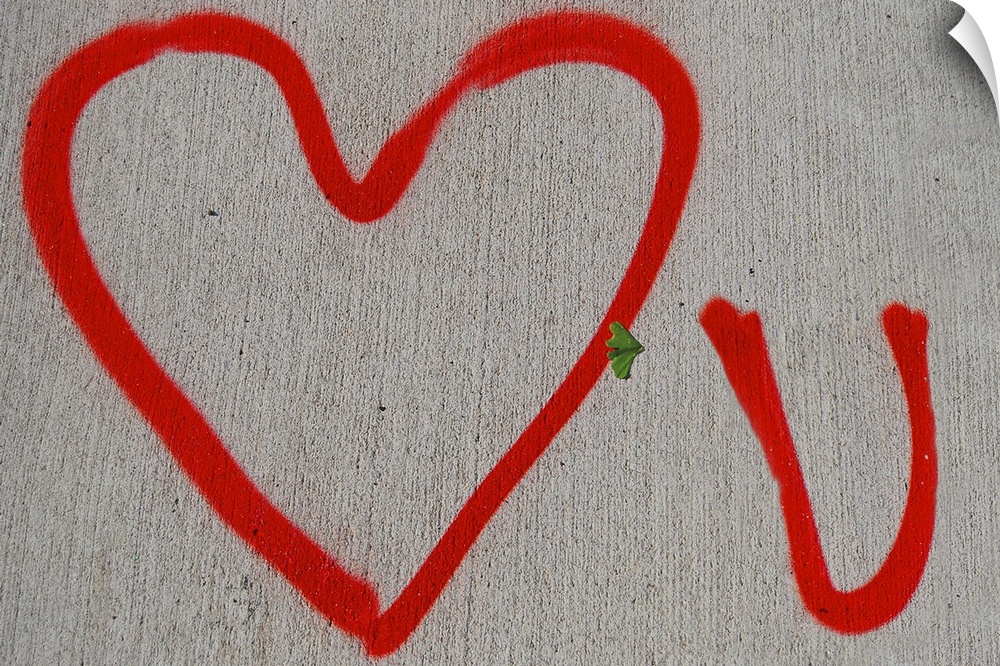 Red Love You graffiti on a New York City sidewalk.