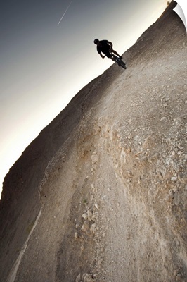 Mountain biker silhouette landscape