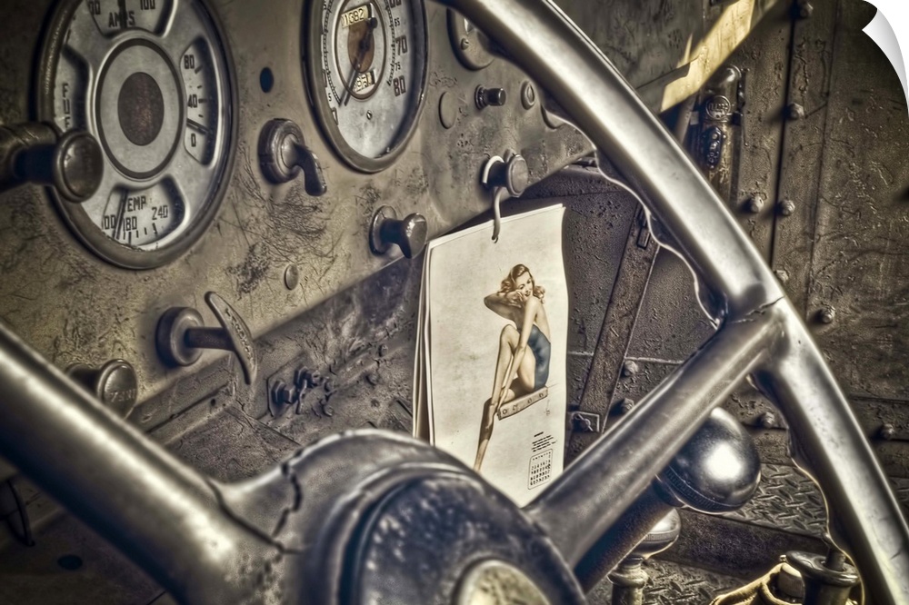 World War II truck interior shows a GI's pin up girl calendar.