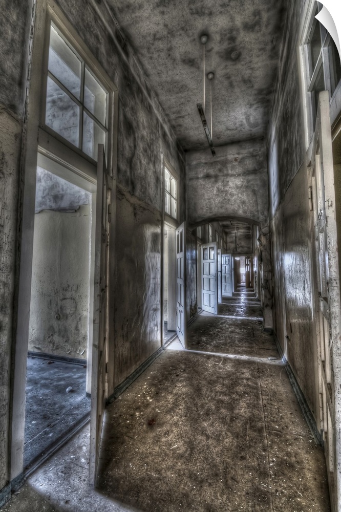 Abandoned lunatic asylum north of Berlin, Germany. Empty corridor with open doors.