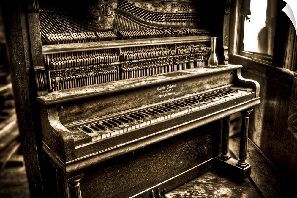 An old upright pianoforte with an open front