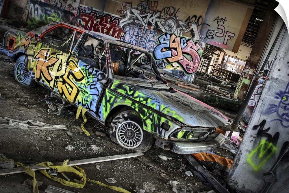 An old BMW car with graffiti