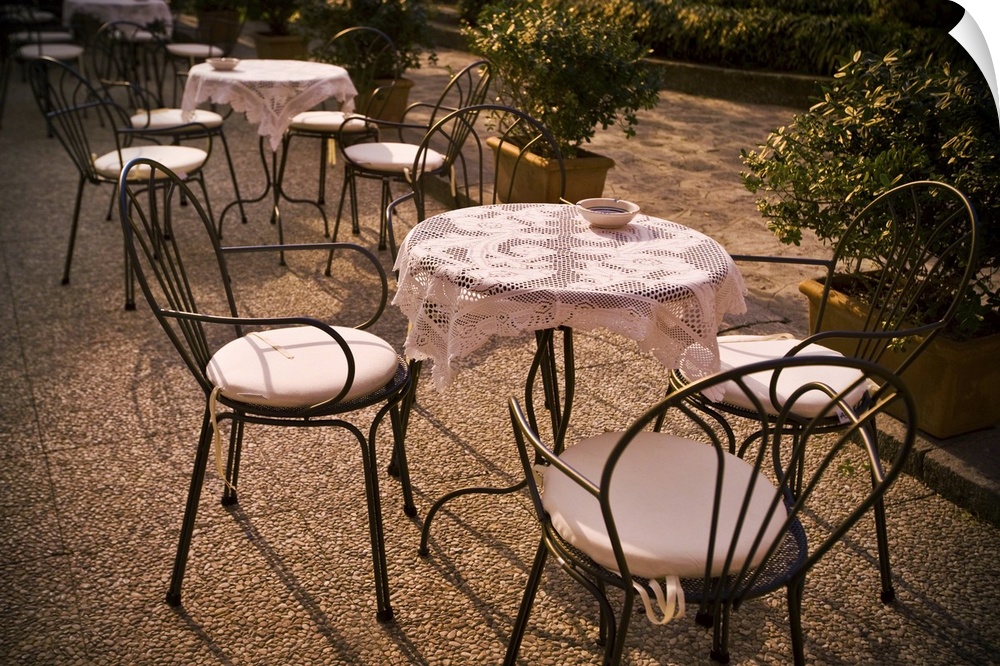 Tables are set at an outdoor bistro in Italy