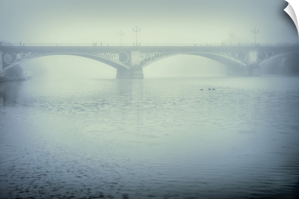 Triana bridge on a misty day, Seville, Spain.