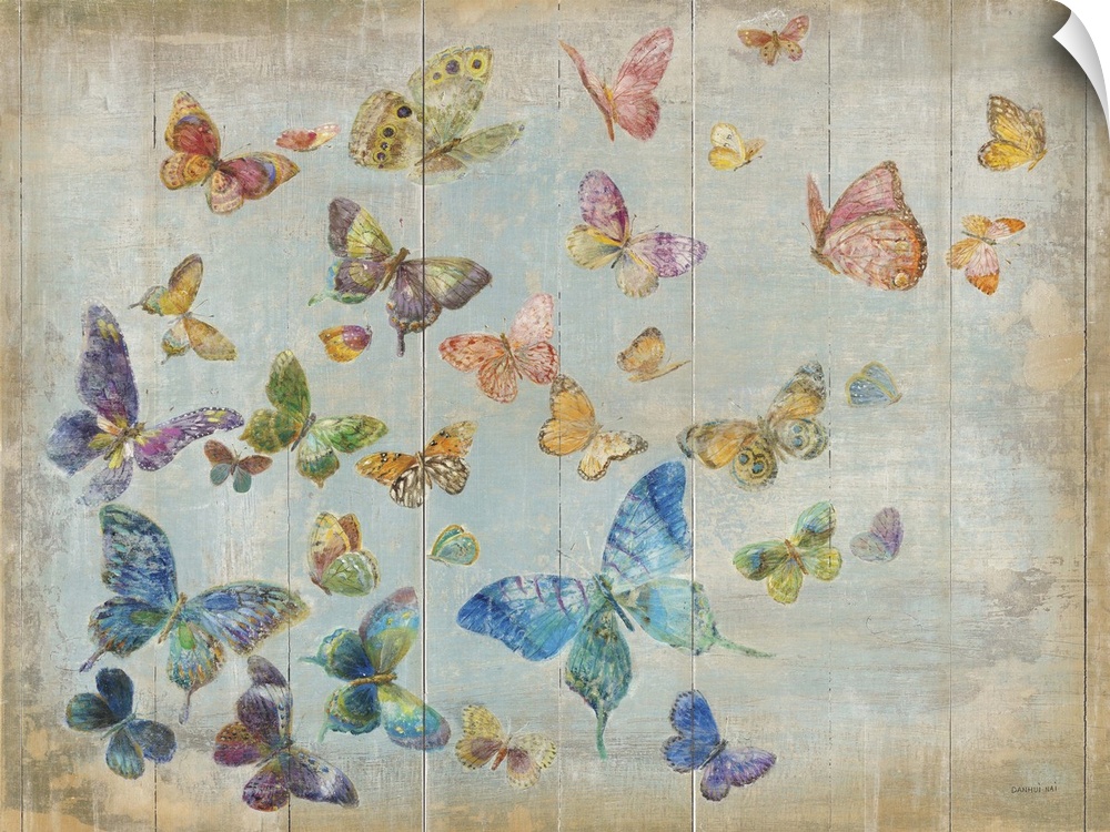 A flock of butterflies of all different colors flying in the sky.