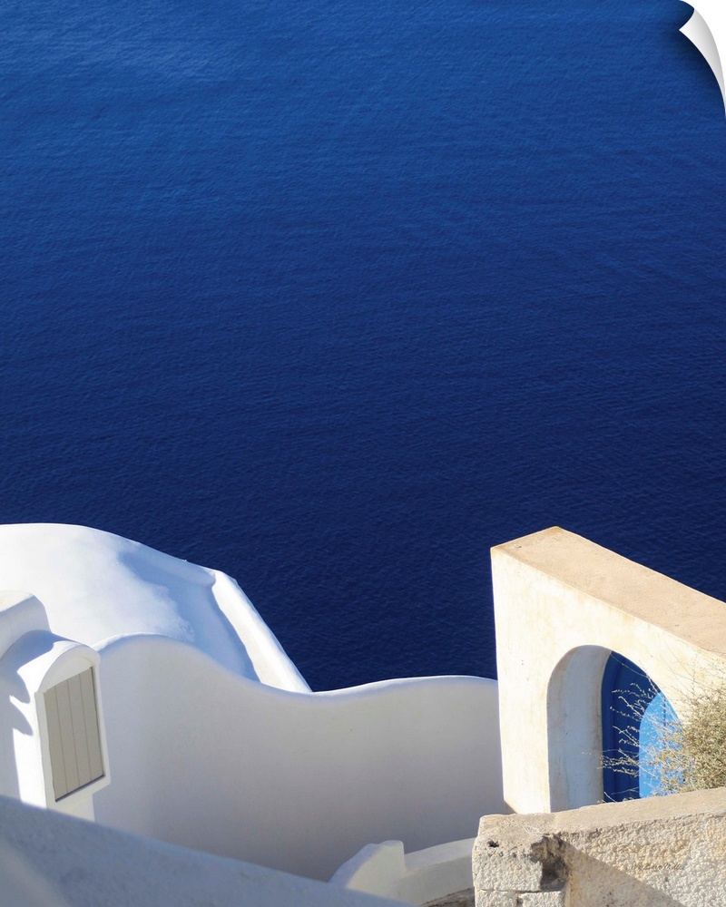 Landscape photograph of the bright blue water in Santorini.