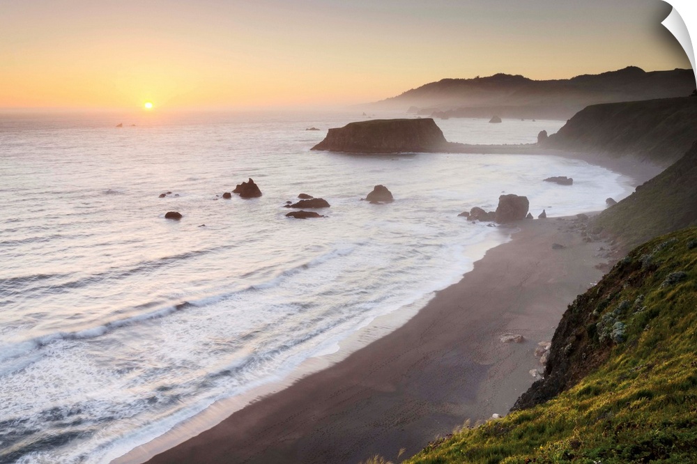 Sunset view of surf beaches and Goat Rock from rugged cliffs and bluffs of Sonoma Coast State Park, California