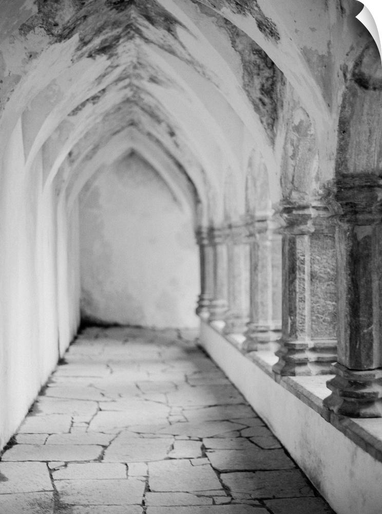 Black and white photograph of the outside walkway of a cathedral, Ireland.
