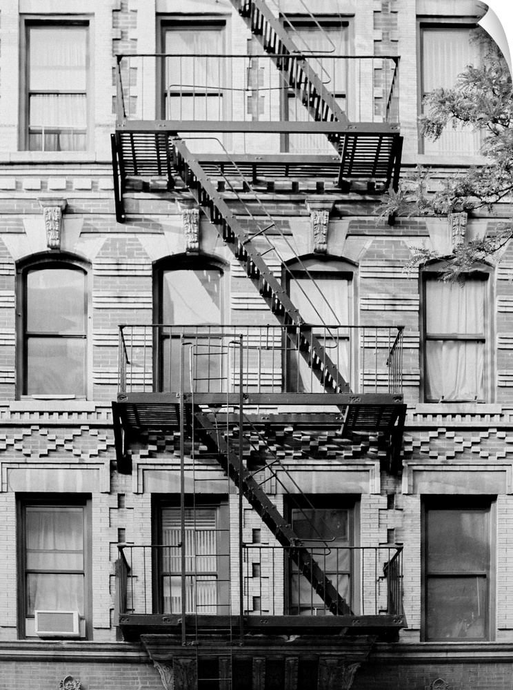 Black and white architectural photo of a New York building's fire escape.
