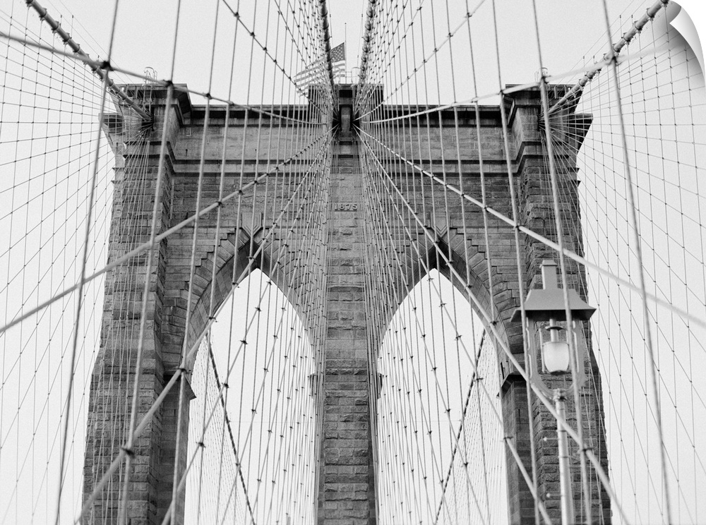 Black and White architectural photograph of New York's Brooklyn Bridge.