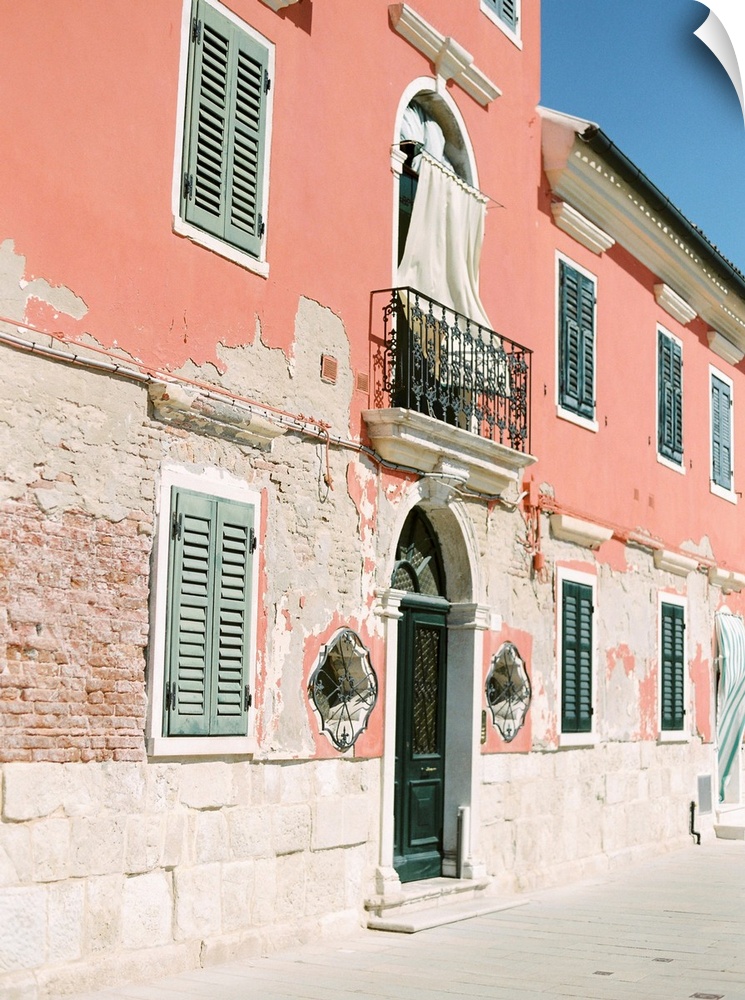 Photograph of ornate doors and windows in old buildings, Burano, Italy.