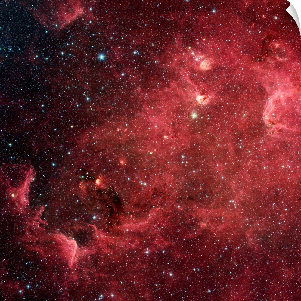This infrared image from NASA's Spitzer Space Telescope shows a swirling landscape of stars known as the North America neb...