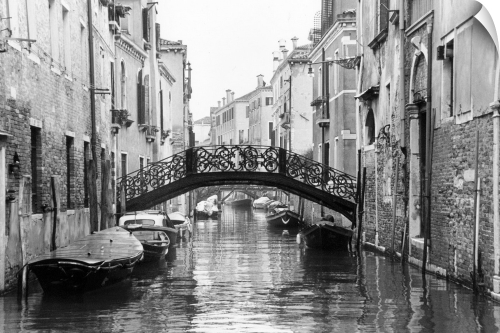 Large photo on canvas of gondolas lining a canal in Venice.
