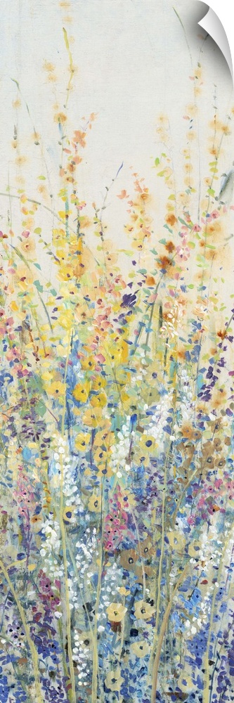 Vertical panel of blooming yellow and blue wildflowers in a field.