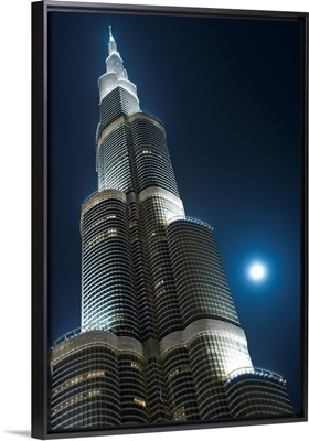 Dubai, Uaemoon And Moving Clouds Behind The Burj Khalifa At Night