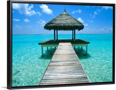 Grass Hut And Pier; The Maldives