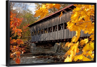 New England, New Hampshire, White Mountains, A Covered Bridge Over A River In Autumn