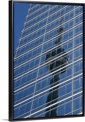 Canada, Ontario, Toronto, Reflection of CN Tower on glass side of skyscraper