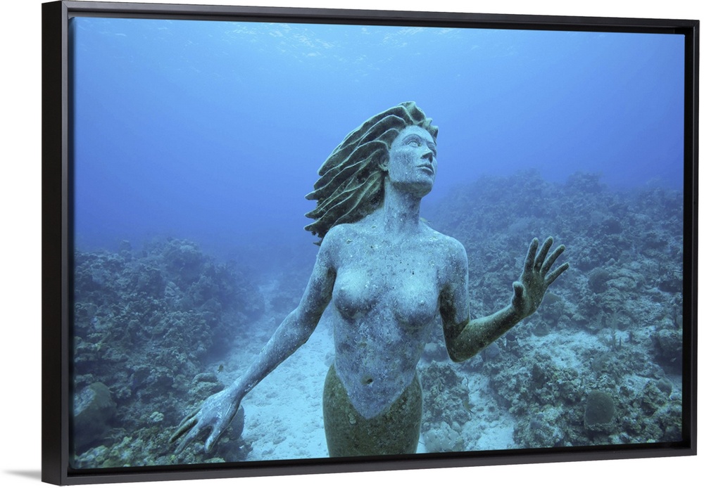 Cayman Islands, Grand Cayman Island, Underwater view mermaid sculpture in shallow coral reefs in Caribbean Sea