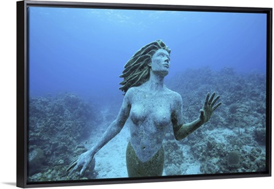 Cayman Islands, Grand Cayman Island, mermaid sculpture in shallow coral reef