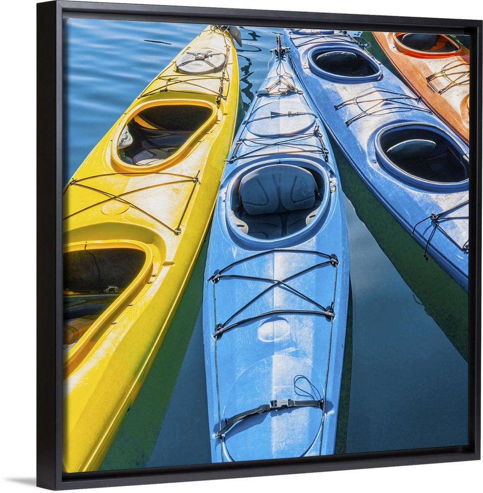 Four Colorful Kayaks Positioned In An Array