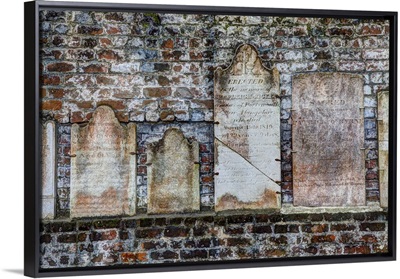 Georgia, Savannah, Tombstones on a wall in Historic Colonial Park Cemetery