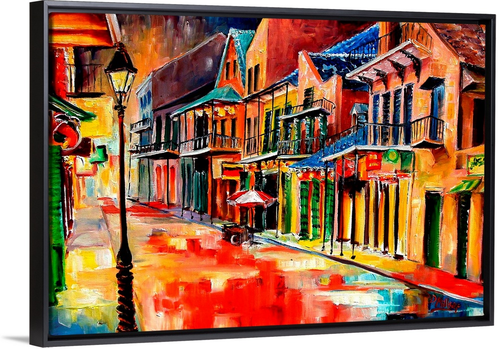 Huge contemporary art shows the vibrantly colored buildings lit up on a quiet street in Louisiana at night.