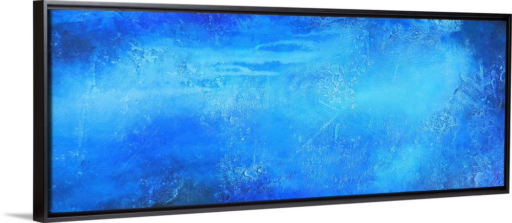 This oversized horizontal painting is a variety of paint textures depicting a central blob of color fading light to dark.
