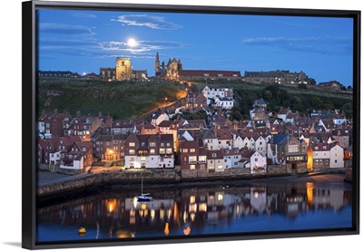 England, North Yorkshire, Whitby, view across the town towards the abbey at night