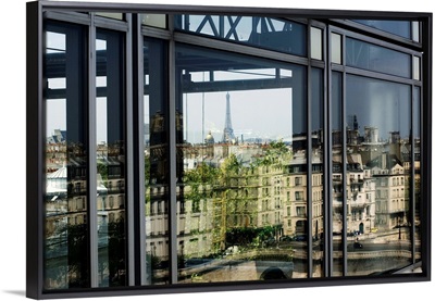 France, Paris, Institut du Monde Arabe with Eiffel Tower reflected on the window