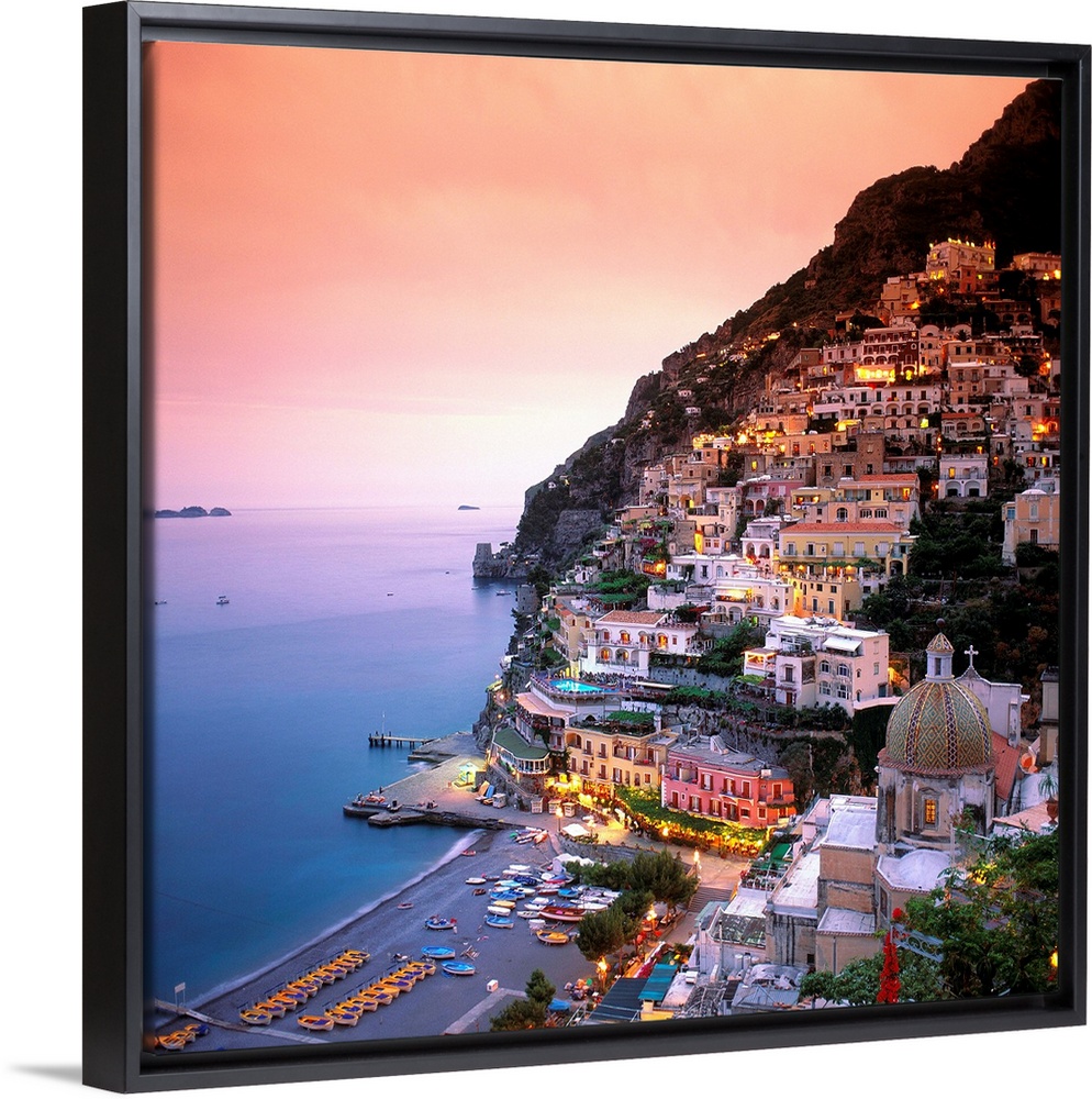 A square shaped photograph of the charming Italian town of Positano at sunset. Built into the cliffs overlooking the Medit...