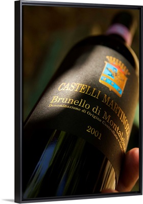 Italy, Tuscany, Castelli Martinozzi wine cellar, Brunello di Montalcino wine bottle