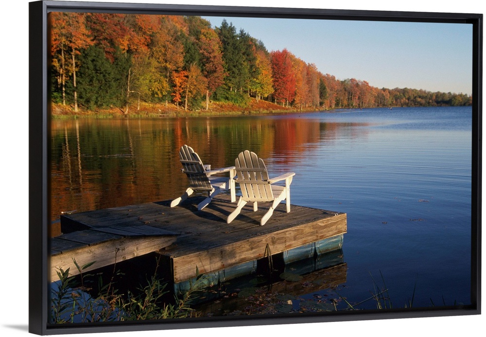 Adirondack Chairs On Dock At Lake