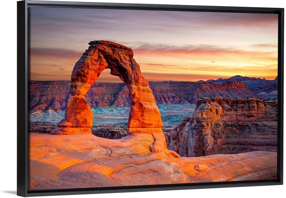 This wall art for the home or office shows desert rock cliffs growing in the light of a sunset.