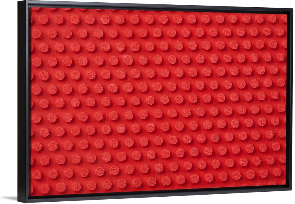 Hi-Res macro image of a studded ping pong paddle.