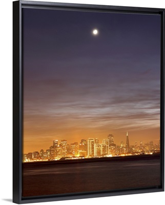 Moon setting over San Francisco on hazy December evening, taken from Treasure Island.