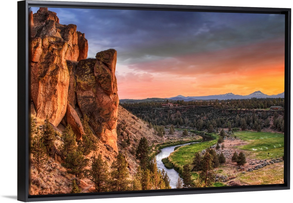 Dramatic sunset creates stunning colors across the Northwestern landscape, where a river runs through a valley separating ...