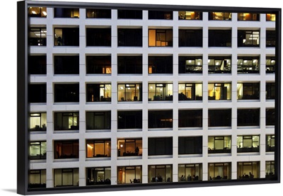 Working later night in office building in financial district of Hong Kong.